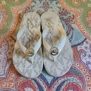 MK flip flops cream color